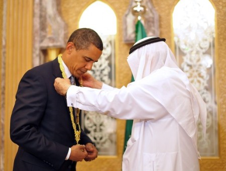 By the way, King Abdullah...I have some dirt on my shoulders, can you brush it off for me? Photo credit should read MANDEL NGAN/AFP/Getty Images)